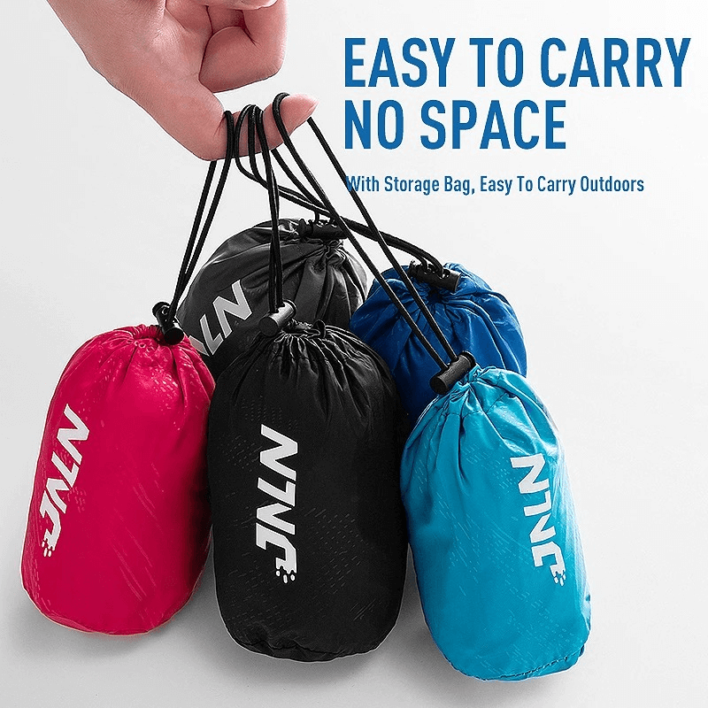 Colorful outdoor track pants in compact storage bags, easy to carry for camping and hiking. Ideal for space-saving travel.